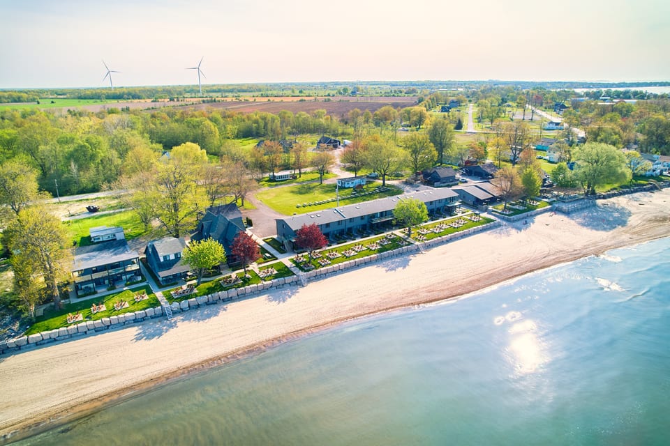 Aerial view of The Long Beach Resort's cottages, suites and private beach on Lake Erie